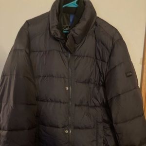 Never used Mens Calvin Klein XL puffer coat. Black in color